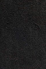 Overhead view of black Terrycloth fabric, close of view of textured terrycloth fabric