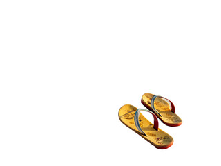 Pair of yellow flip flops resting on a dark surface