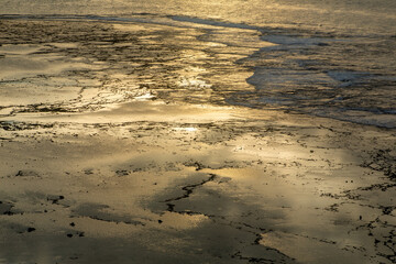 夏の奄美大島の夜明け前の珊瑚礁の海。