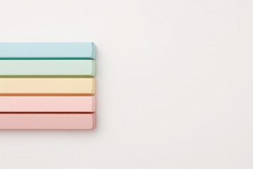 Stacked Pastel Colored Chalk Pastels on White Background artist artistic
