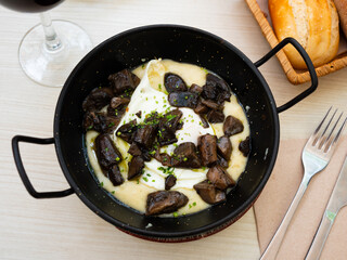 Nice portion of eggs with mushrooms served in potato casserole