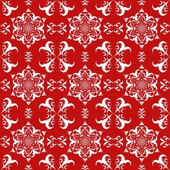 Red and white seamless pattern with symmetrical floral and geometric motifs. 