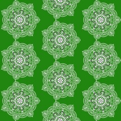 Elegant floral mandala pattern on vibrant green background for festive designs and creative projects