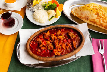 Turkish lamb chop casserole served on table with refreshments