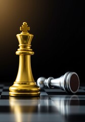 Gold King Chess Piece Standing Upright on a Chessboard with Fallen Silver King Chess Piece in Background