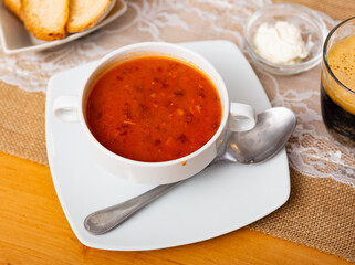 Appetizing shchi soup with beef broth and sauerkraut served in bowl