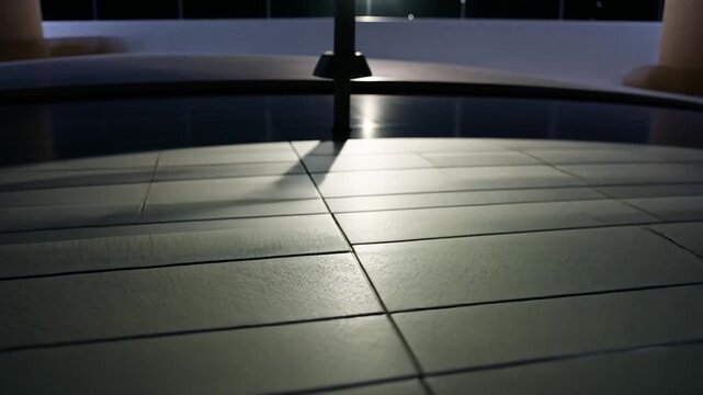 Close-up of a car's rear window with defroster lines and shadow patterns
