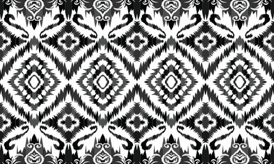 Seamless geometric ethnic pattern in black and white. Abstract hand drawn retro texture.