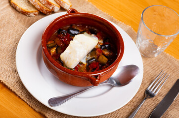 Bacalao is a popular dish Portuguese cuisine made from cod with stewed vegetables