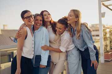 A Joyful Group of Close Friends Happily Enjoying a Beautiful and Sunny Day Outdoors