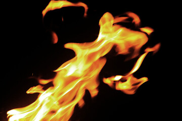 Close up burning flames on black background for graphic design or wallpaper.