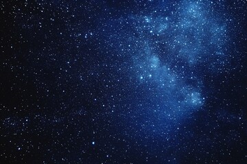 Fototapeta premium Starry sky background, blue night sky full of stars, glowing stars in the dark space, starry background, dark night, stars in the distance, starlight, dark background with a blue glow, night sky. 