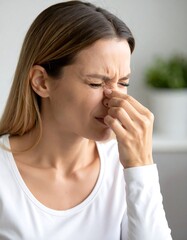 Woman holding her nose, expressing discomfort