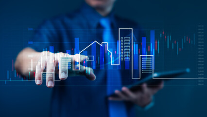 Businessman touching digital real estate investment interface with candlestick chart for property market analysis and smart financial planning