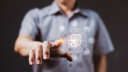Businessman using virtual interface with travel icons for digital booking and global tourism planning via modern technology