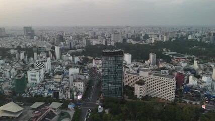 Vietnam Sunrise Aerial – 4K Drone Footage of Ho Chi Minh City, Skyscrapers, Modern Buildings, Dense Housing, and Expansive Urban Landscape in Morning Atmosphere