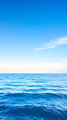 Obraz premium Calm ocean meeting a clear sky