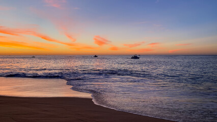 Naklejka premium Fishing Boats Going out for the Day at Sunrise in Cabo San Lucas Mexico