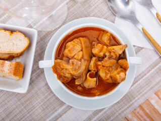 Popular dish of Spanish cuisine is Manos de cerdo, made from pork legs with tomato sauce and pepper