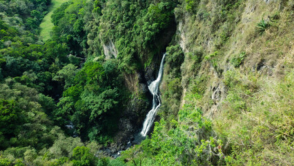 Aerial View of Twin Waterfall Cascading Through a Lush Green Canyon in Costa Rica
