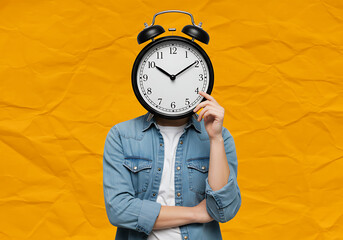 A person with an alarm clock as their head, symbolizing time and deadlines, stands against a vibrant crumpled orange background.