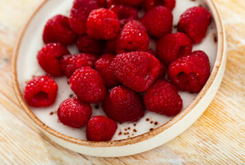 Fresh juicy berries served to table in restaurant