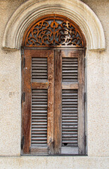 Old wood window on concrete wall