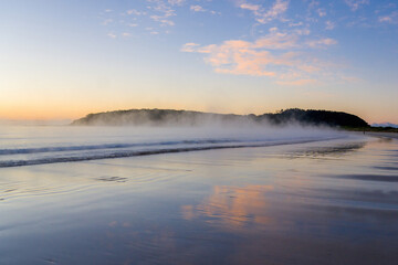 Misty sunrise at Broulee Beach, New South Wales, Australia