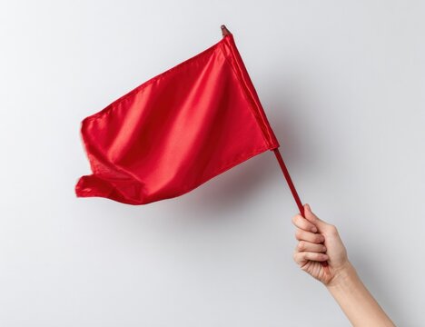 Silky Red Flag Held Aloft, a Potent Symbol of Warning on a Minimalist Background