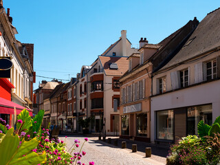 Cityscape of old French town of Sens with shops and outdoors cafe at summer