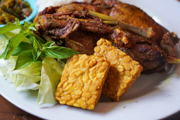 Duck Rice with Green Chili Sambal, Indonesia, captured on August 6, 2025. Steamed rice served with crispy fried duck and a spicy green chili sambal, a bold and flavorful Indonesian specialty