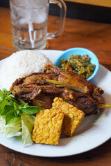 Duck Rice with Green Chili Sambal, Indonesia, captured on August 6, 2025. Steamed rice served with crispy fried duck and a spicy green chili sambal, a bold and flavorful Indonesian specialty