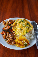 **Nasi Rames, Indonesia, captured on August 6, 2025. Mixed rice dish with assorted side dishes like tempeh, vegetables, sambal, and curry, showcasing a colorful and flavorful everyday Indonesian meal