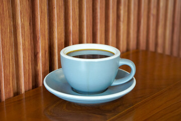 Hot Americano, Indonesia, captured on August 6, 2025. A bold black coffee served in a clean ceramic cup, rich aroma rising with steam, perfect for a minimalist café scene or a calm morning at work