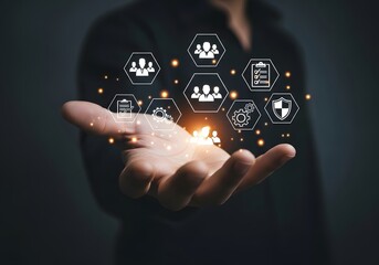 Person s hand displays holographic network of connected people and business icons