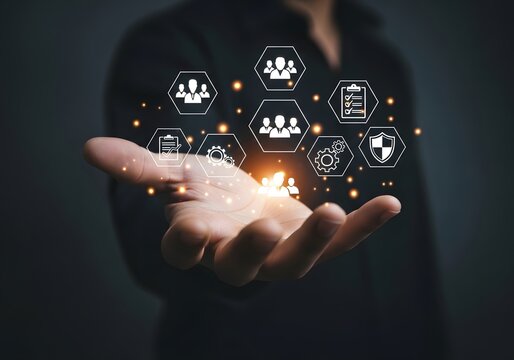 Person s hand displays holographic network of connected people and business icons