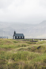 Budir black church ,Iceland ,Winter. Vertical shot with copy space