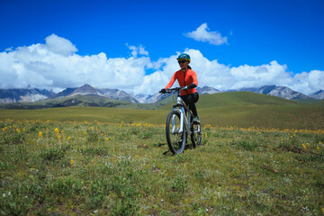Fototapeta premium Trail runner running on the high altitude grassland mountain top trail