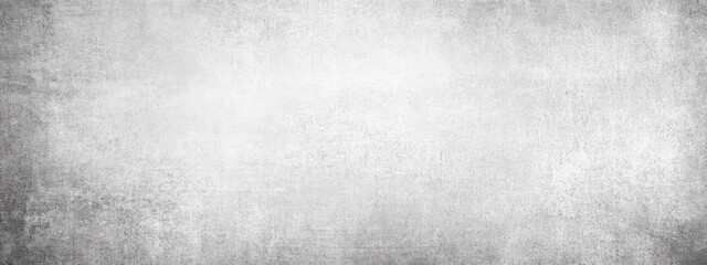 Obraz premium A grayscale textured background with a subtly lighter central area and darker, mottled edges, creating a faded, aged effect