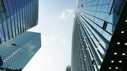 Modern Glass Facade High Rise Skyscrapers Against Blue Sky
