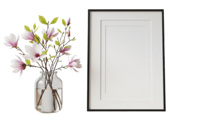 Vertical picture frame mockup with white mat and black border stands on a wooden shelf with a vase of blooming magnolia branches creating a modern interior design layout 