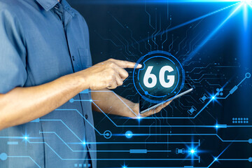 Businessman pointing at a futuristic speedometer showing 6G network speed and performance.to technology, innovation, high-speed internet, the future of communication.