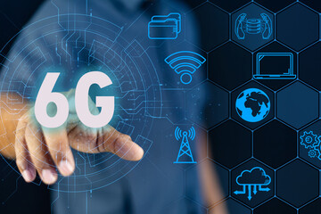 Businessman pointing at a futuristic speedometer showing 6G network speed and performance.to technology, innovation, high-speed internet, the future of communication.