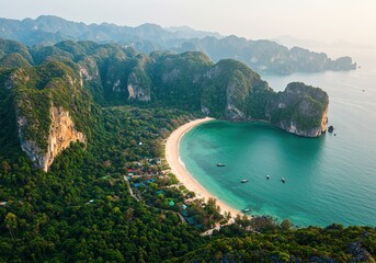 Aerial view of a stunning tropical island with a crescent beach and turquoise waters
