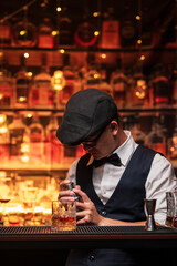 Bartender is pouring whiskey into a glass in a restaurant