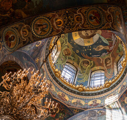 Obraz premium interior of Savior on the Spilled Blood church with a colorful mosaic of biblical scenes and luxury shining chandelier in Saint Petersburg, Russia, 21st of July, 2025, famous landmark