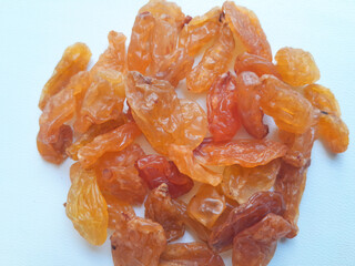 dried apricots on white background. golden raisins on white