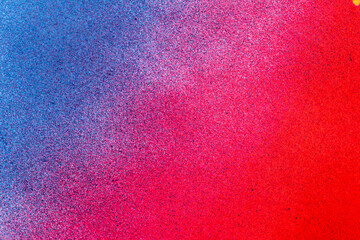 赤色と青色のスプレー塗料で塗った背景	