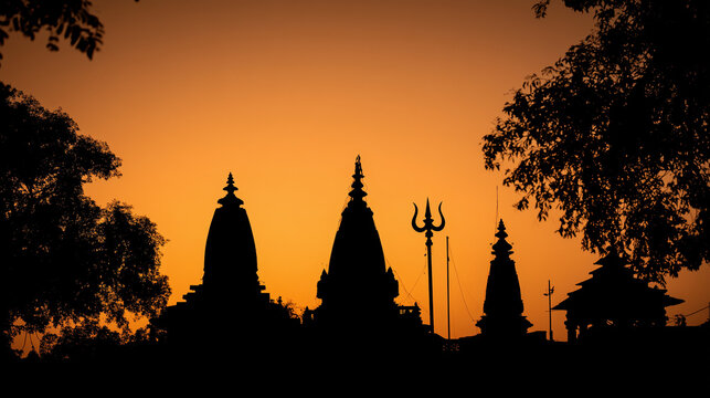 Mahakaal temple silhouette in Ujjain during twilight, trishul and damaru in foreground