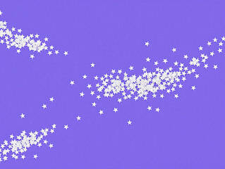 Photo of scattered white star confetti on a vibrant purple background